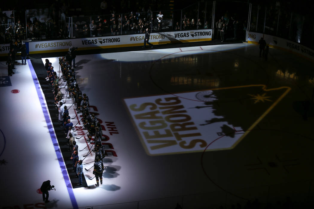 Victims and first responders of the Route 91 Harvest Festival shooting are honored before the start of an NHL hockey game between the Vegas Golden Knights and the Arizona Coyotes at T-Mobile Arena ...