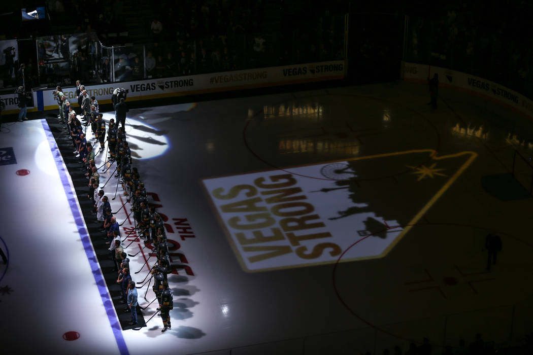 Victims and first responders of the Route 91 Harvest Festival shooting are honored before the start of an NHL hockey game between the Vegas Golden Knights and the Arizona Coyotes at T-Mobile Arena ...