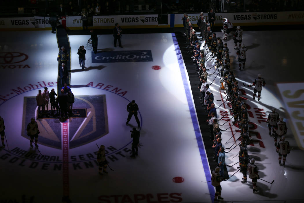 Victims and first responders of the Route 91 Harvest Festival shooting are honored before the start of an NHL hockey game between the Vegas Golden Knights and the Arizona Coyotes at T-Mobile Arena ...