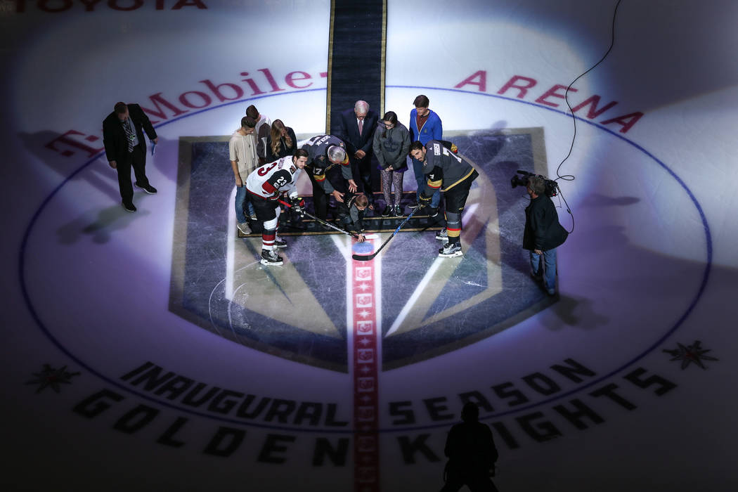 The ceremonial puck drop before the start of an NHL hockey game between the Vegas Golden Knights and the Arizona Coyotes at T-Mobile Arena in Las Vegas, Tuesday, Oct. 10, 2017. Joel Angel Juarez L ...