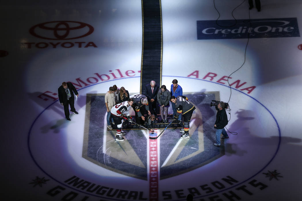 The ceremonial puck drop before the start of an NHL hockey game between the Vegas Golden Knights and the Arizona Coyotes at T-Mobile Arena in Las Vegas, Tuesday, Oct. 10, 2017. Joel Angel Juarez L ...