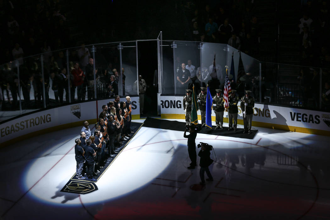 A ceremony honoring victims and first responders of the Route 91 Harvest Festival shooting before the start of an NHL hockey game between the Vegas Golden Knights and the Arizona Coyotes at T-Mobi ...