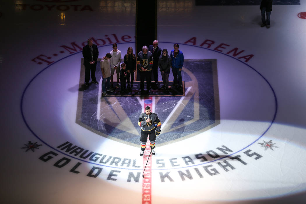 Vegas Golden Knights defenseman Deryk Engelland (5), center, speaks during a ceremony honoring victims and first responders of the Route 91 Harvest Festival shooting before the start of an NHL hoc ...