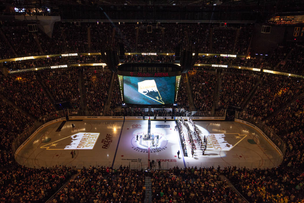 The ceremonial puck drop before the start of an NHL hockey game between the Vegas Golden Knights and the Arizona Coyotes at T-Mobile Arena in Las Vegas, Tuesday, Oct. 10, 2017. Joel Angel Juarez L ...