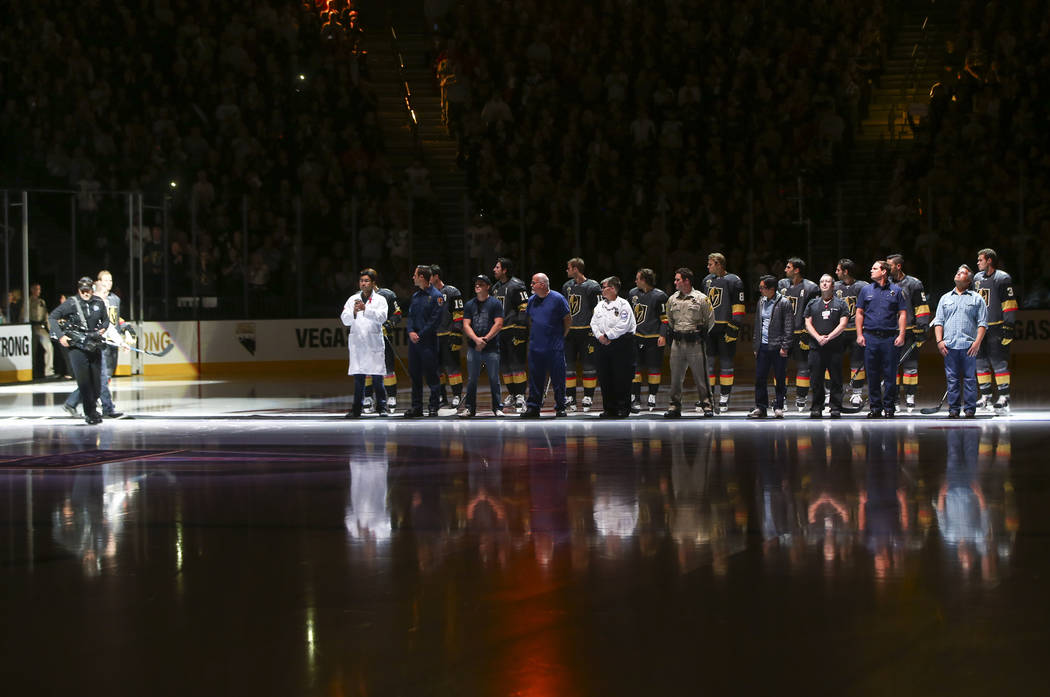 Members of the Vegas Golden Knights are introduced with first responders before playing the Arizona Coyotes in an NHL hockey game at T-Mobile Arena in Las Vegas on Tuesday, Oct. 10, 2017. Chase St ...