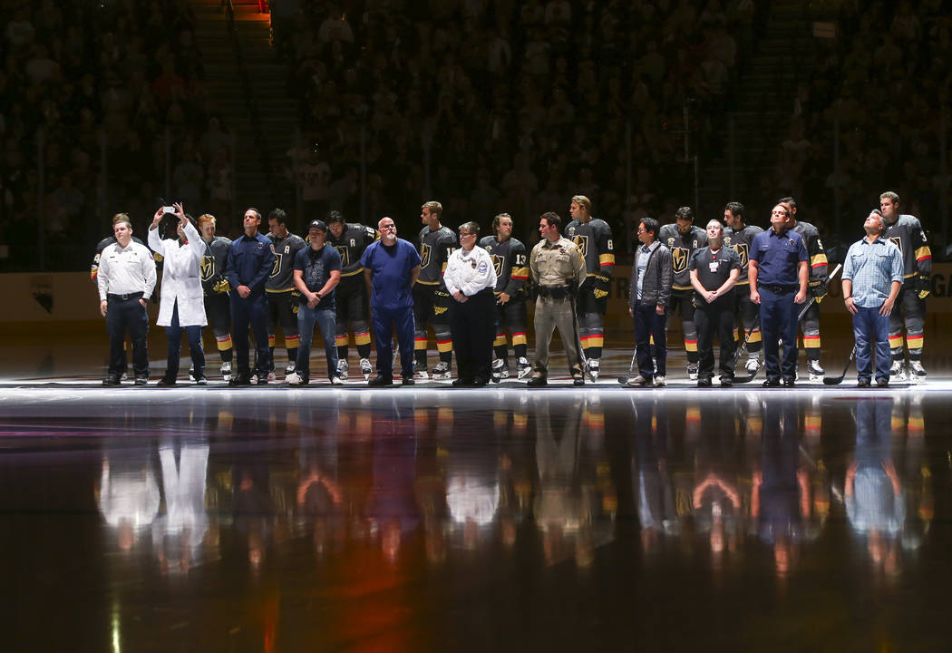 Members of the Vegas Golden Knights are introduced with first responders before playing the Arizona Coyotes in an NHL hockey game at T-Mobile Arena in Las Vegas on Tuesday, Oct. 10, 2017. Chase St ...