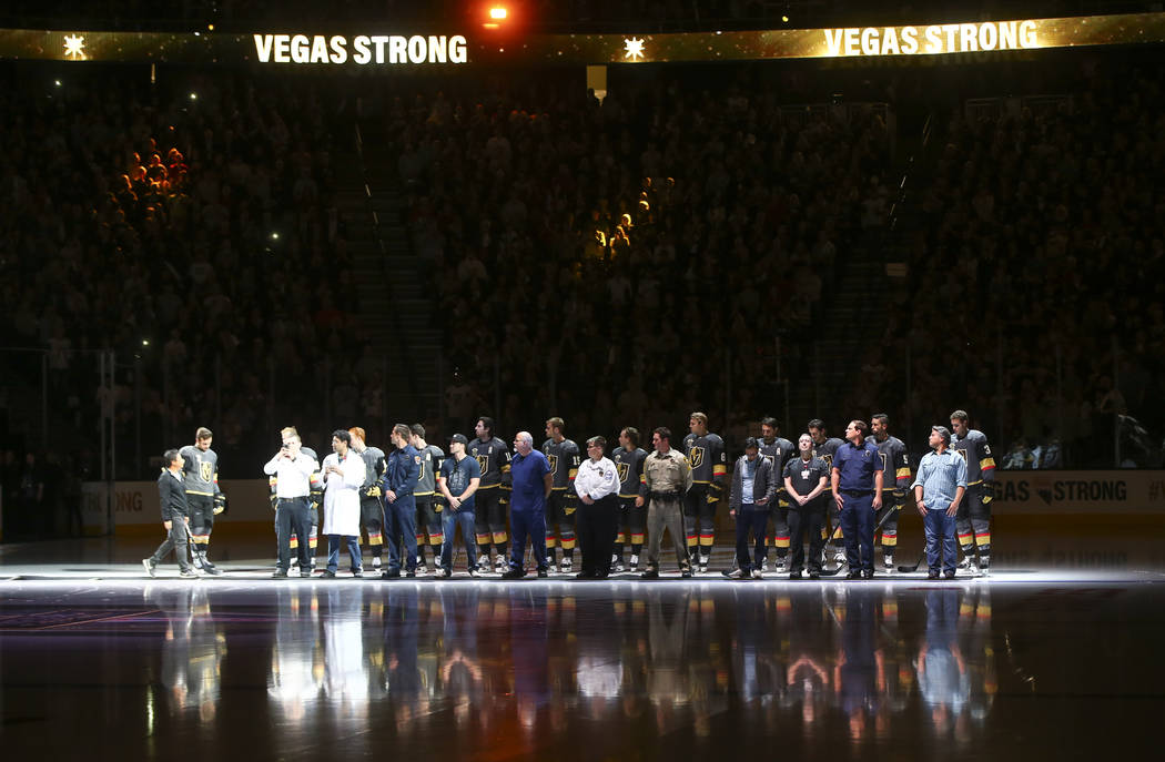 Members of the Vegas Golden Knights are introduced with first responders before playing the Arizona Coyotes in an NHL hockey game at T-Mobile Arena in Las Vegas on Tuesday, Oct. 10, 2017. Chase St ...