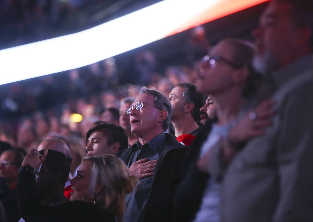 Fans sing the national anthem before an NHL hockey game between the Vegas Golden Knights and Arizona Coyotes at T-Mobile Arena in Las Vegas on Tuesday, Oct. 10, 2017. Chase Stevens Las Vegas Revie ...