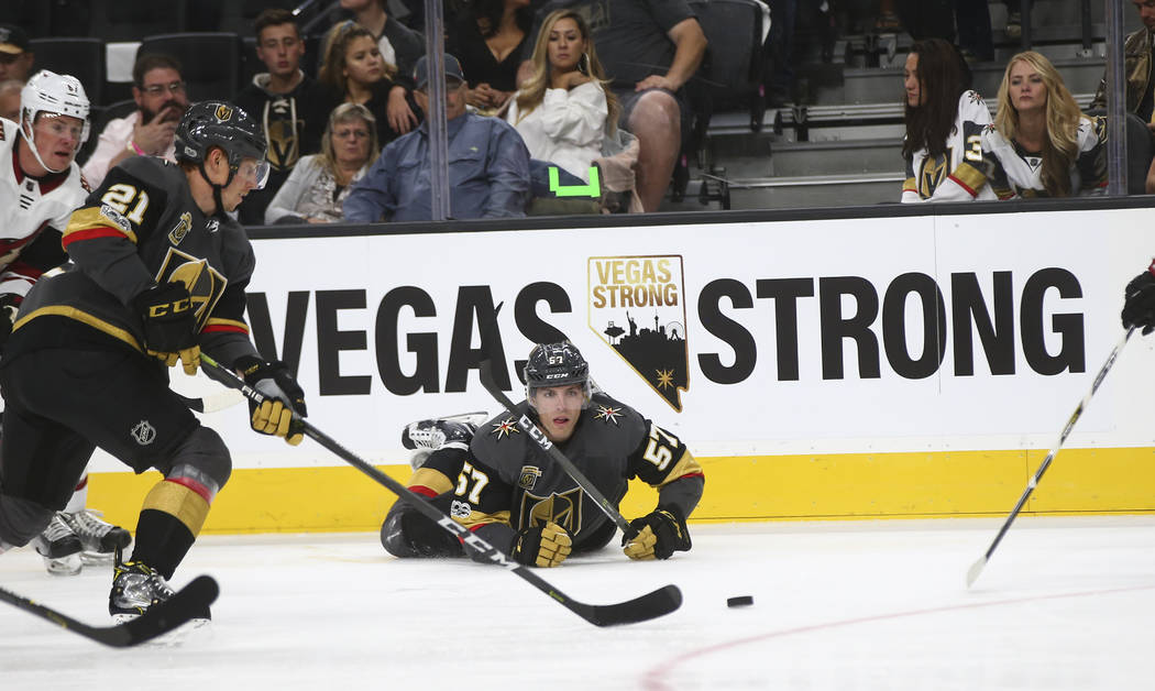 Vegas Golden Knights David Perron (57) and Cody Eakin (21) go after the puck against the Arizona Coyotes during an NHL hockey game at T-Mobile Arena in Las Vegas on Tuesday, Oct. 10, 2017. Chase S ...
