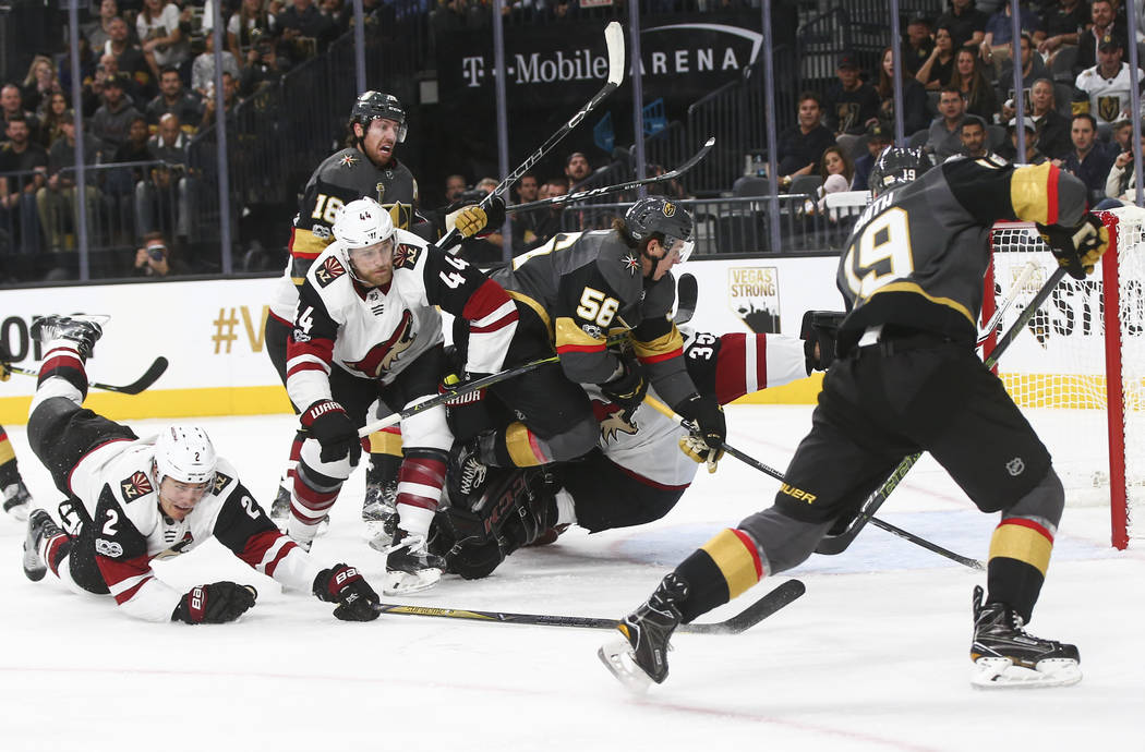Vegas Golden Knights players attempt to score against the Arizona Coyotes during an NHL hockey game at T-Mobile Arena in Las Vegas on Tuesday, Oct. 10, 2017. Chase Stevens Las Vegas Review-Journal ...