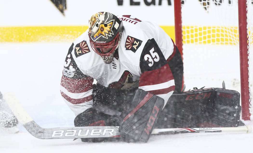 Arizona Coyotes goalie Louis Domingue (35) blocks a shot from the Vegas Golden Knights during an NHL hockey game at T-Mobile Arena in Las Vegas on Tuesday, Oct. 10, 2017. The Golden Knights won 5- ...