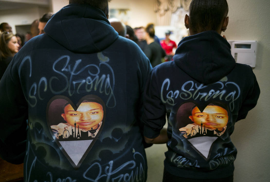 Coworkers show off hooded sweatshirts made in the memory of Erick Silva, during a memorial service at Davis Funeral Home in Las Vegas on Wednesday, Oct. 11, 2017. Silva was working as a security g ...