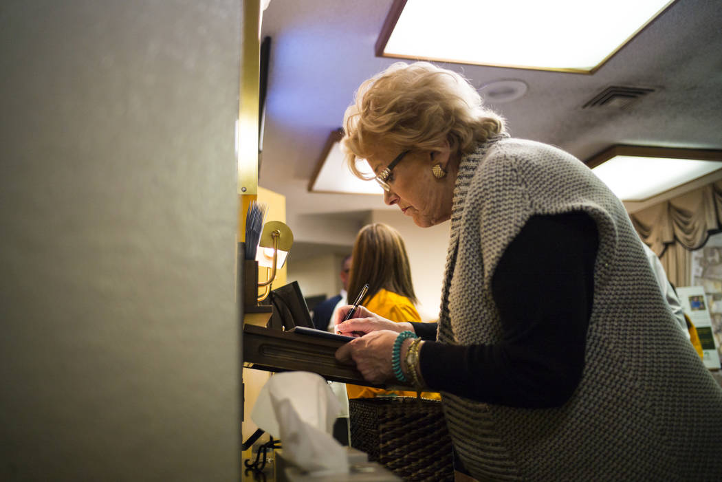 Las Vegas Mayor Carolyn Goodman signs a guestbook during a memorial service for Erick Silva at Davis Funeral Home in Las Vegas on Wednesday, Oct. 11, 2017. Silva was working as a security guard at ...