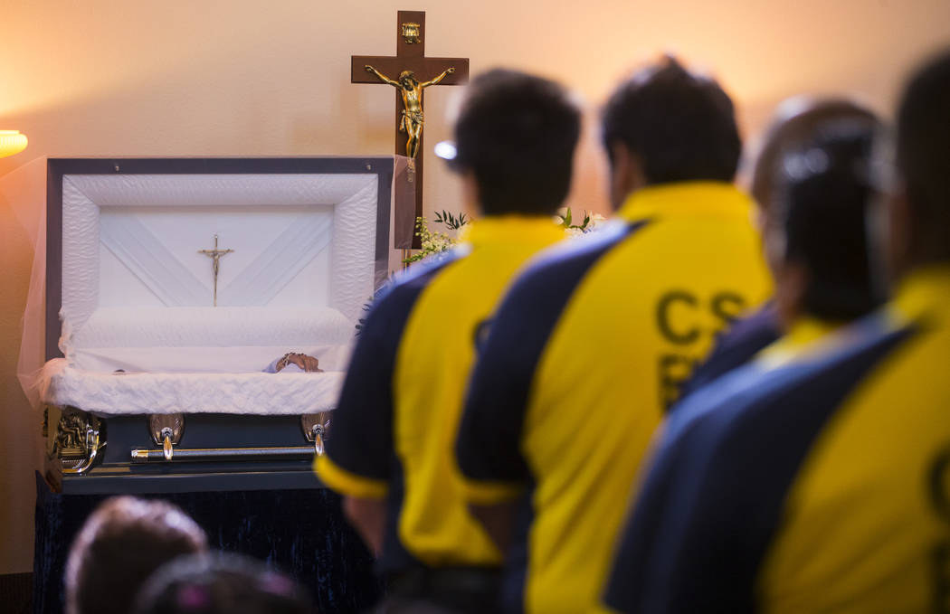 Contemporary Services Corporation employees, many of whom worked with Erick Silva, fill the aisles during funeral services for Silva at Davis Funeral Home & Memorial Park in Las Vegas on Thurs ...
