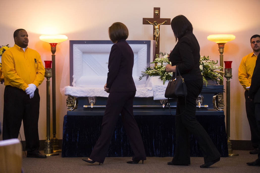 U.S. Sen. Catherine Cortez Masto, second from left, pays her respects during funeral services for Erick Silva at Davis Funeral Home & Memorial Park in Las Vegas on Thursday, Oct. 12, 2017. Sil ...