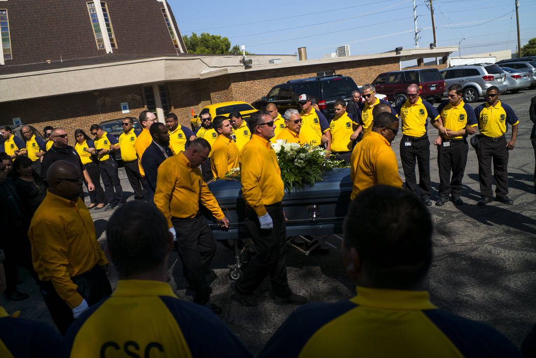 Pallbearers carry the casket of Erick Silva during funeral services at Davis Funeral Home & Memorial Park in Las Vegas on Thursday, Oct. 12, 2017. Silva was working as a security guard at the  ...