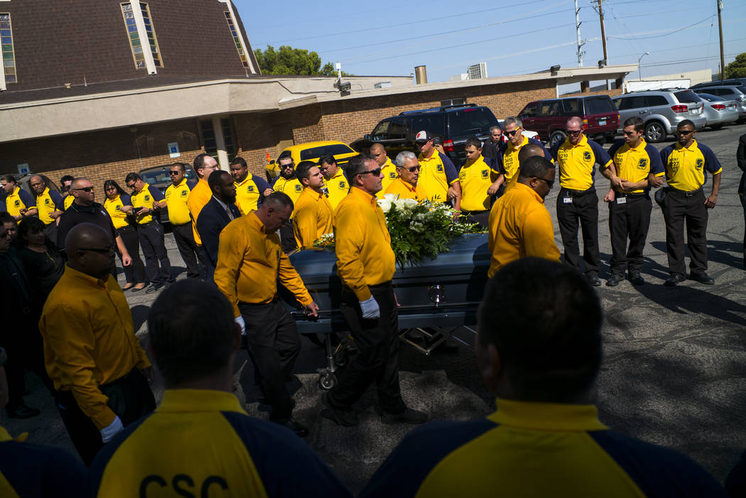 Pallbearers carry the casket of Erick Silva during funeral services at Davis Funeral Home & Memorial Park in Las Vegas on Thursday, Oct. 12, 2017. Silva was working as a security guard at the ...