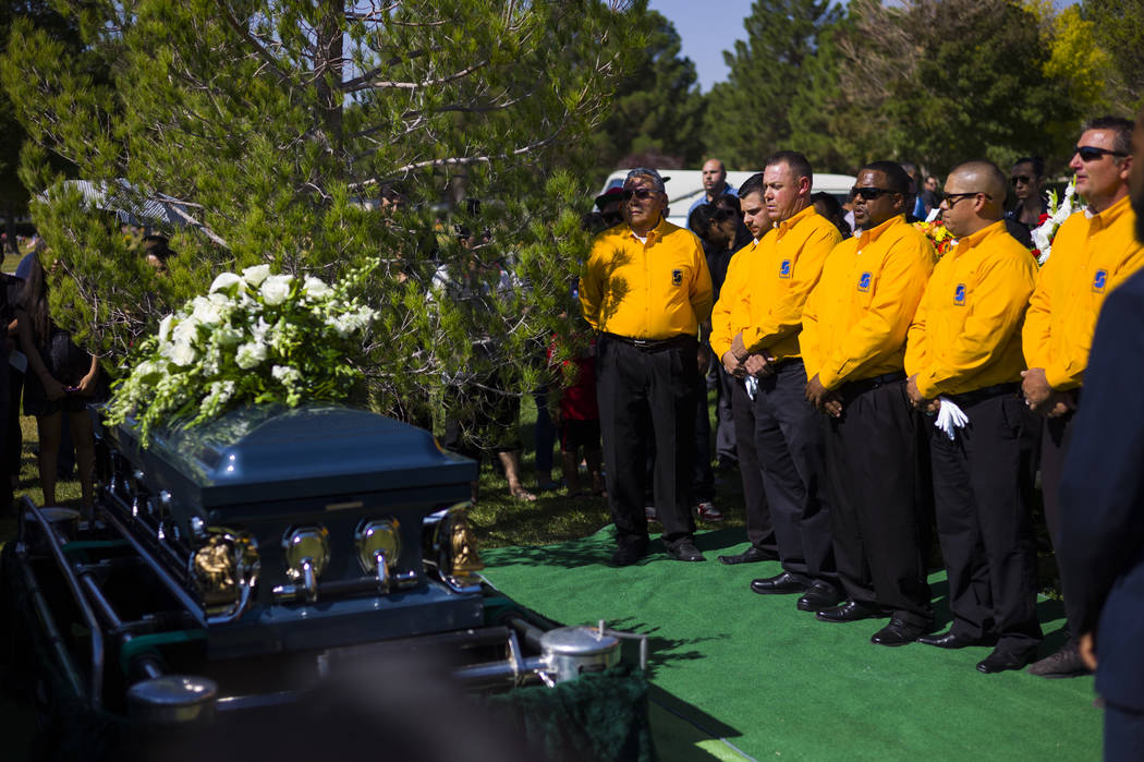 Pallbearers next to the casket of Erick Silva during funeral services at Davis Funeral Home & Memorial Park in Las Vegas on Thursday, Oct. 12, 2017. Silva was working as a security guard at th ...