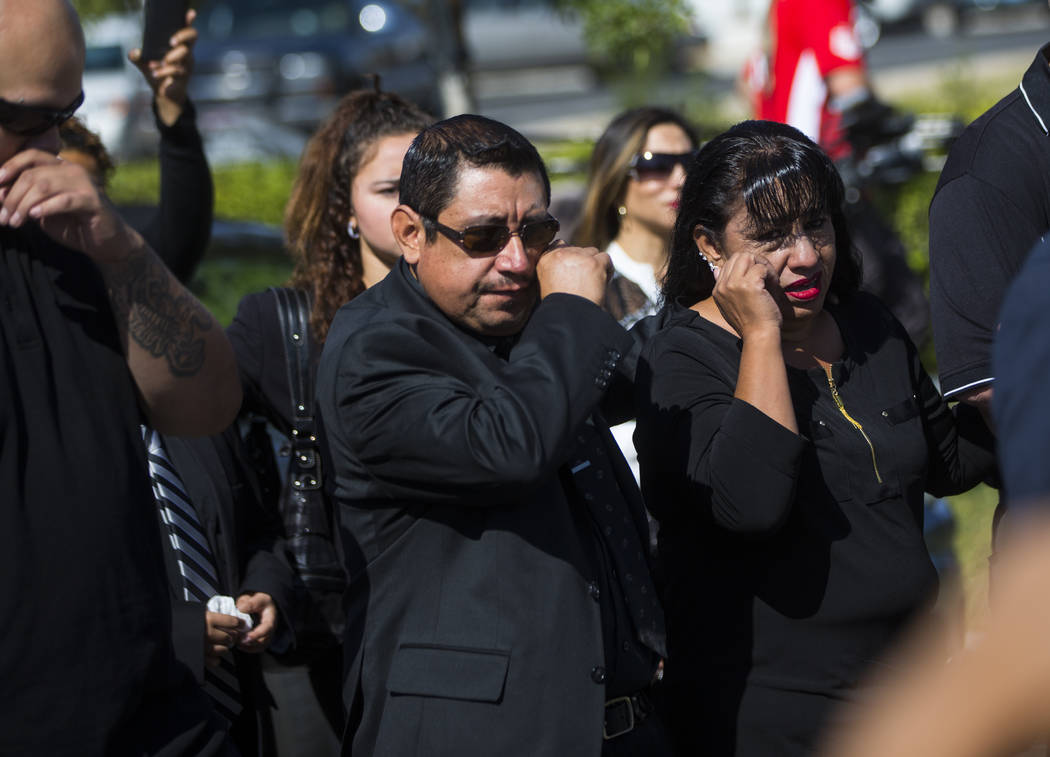 Gregorio De La Rosa, left, and Angelica Cervantes, mother of Erick Silva, follow the casket of Silva during funeral services at Davis Funeral Home & Memorial Park in Las Vegas on Thursday, Oct ...