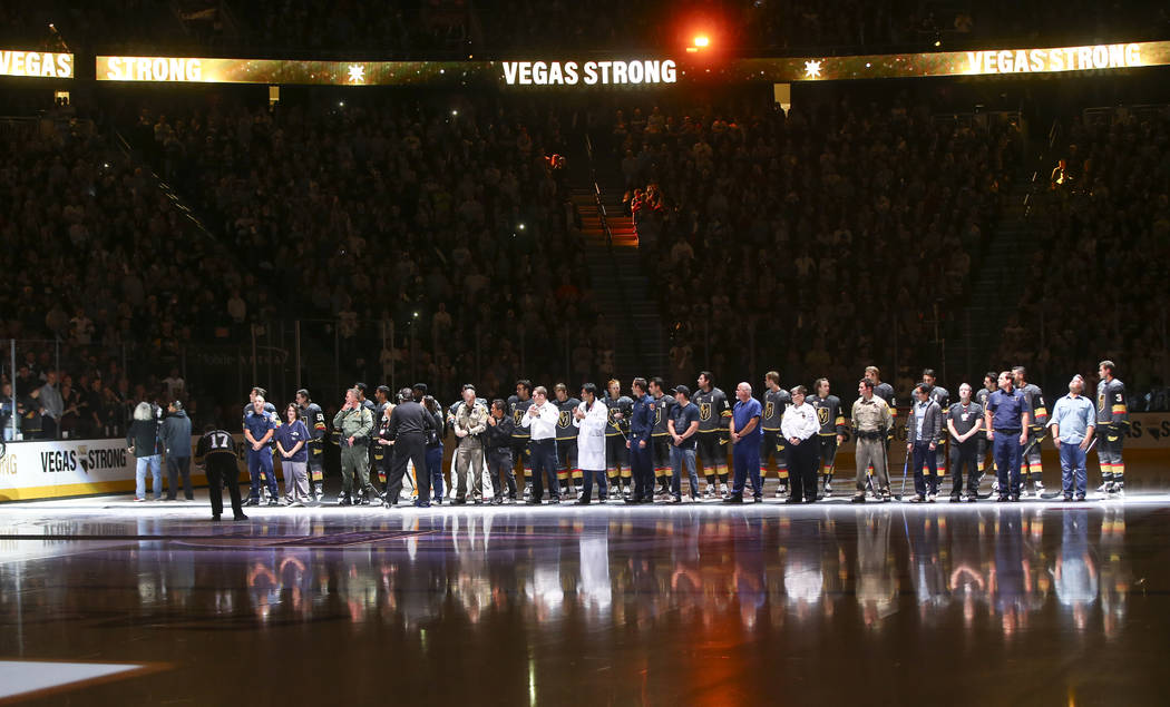 Members of the Vegas Golden Knights are introduced with first responders before playing the Arizona Coyotes in an NHL hockey game at T-Mobile Arena in Las Vegas on Tuesday, Oct. 10, 2017. Chase St ...