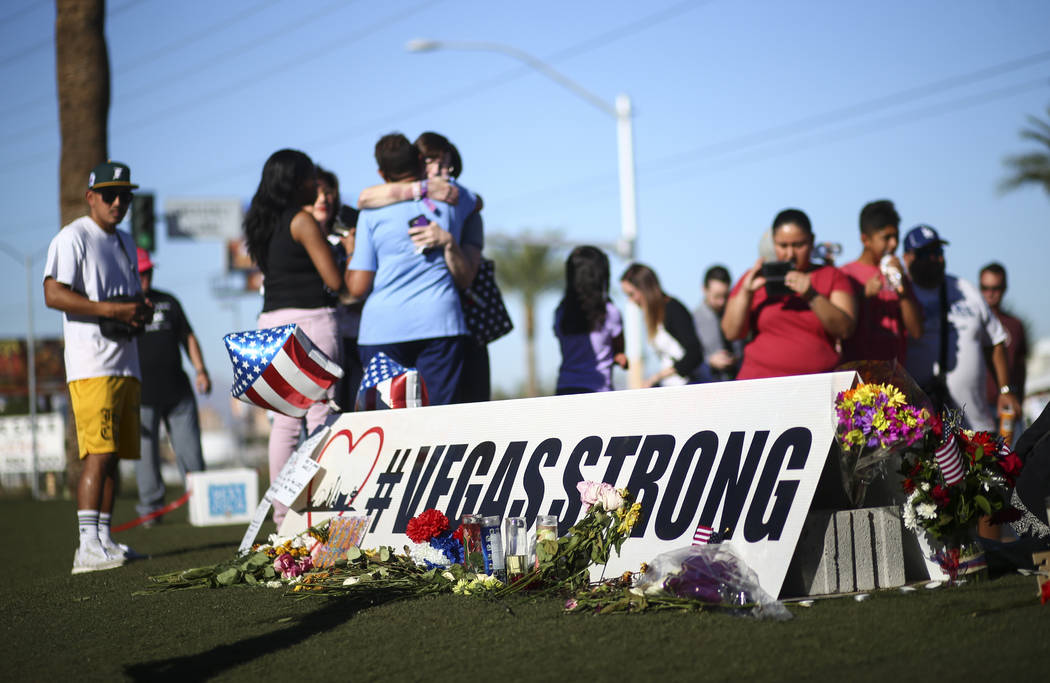 People visit a makeshift memorial for victims of the mass shooting near the "Welcome to Fabulous Las Vegas" sign in Las Vegas on Saturday, Oct. 7, 2017. Chase Stevens Las Vegas Review-Journal @css ...