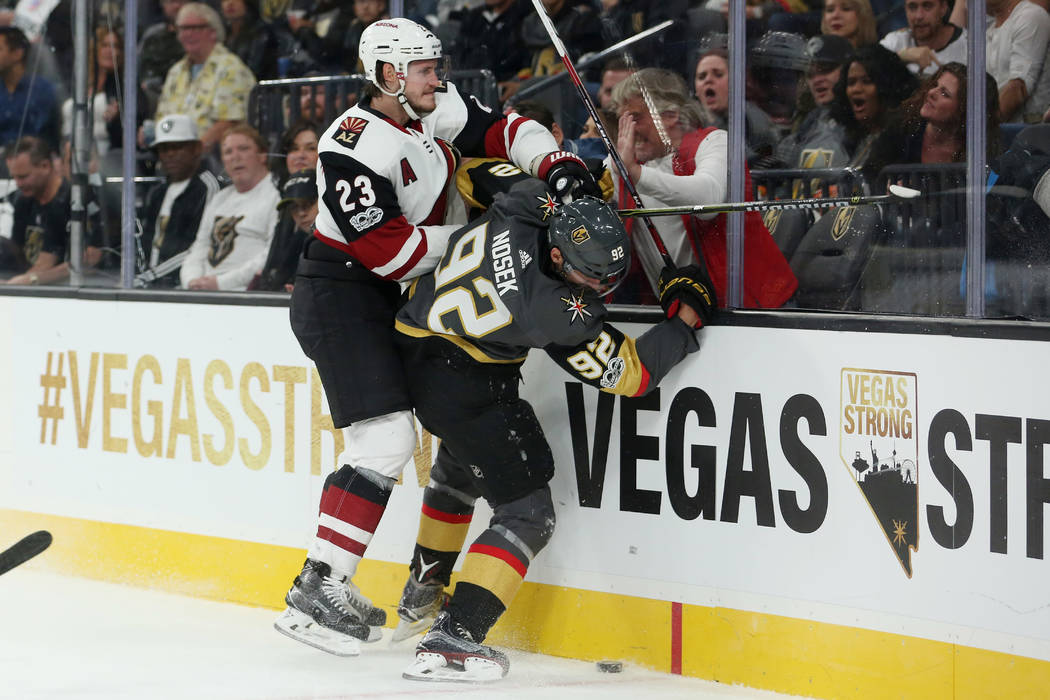 Arizona Coyotes defenseman Oliver Ekman-Larsson (23) checks Vegas Golden Knights left wing Tomas Nosek (92) into the glass during the second period at T-Mobile Arena in Las Vegas, Tuesday, Oct. 10 ...