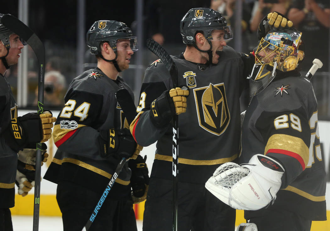 Vegas Golden Knights defenseman Brayden McNabb (3) and Vegas Golden Knights goalie Marc-Andre Fleury (29) embrace after their 5-2 win over  the Arizona Coyotes at T-Mobile Arena in Las Vegas, Tues ...
