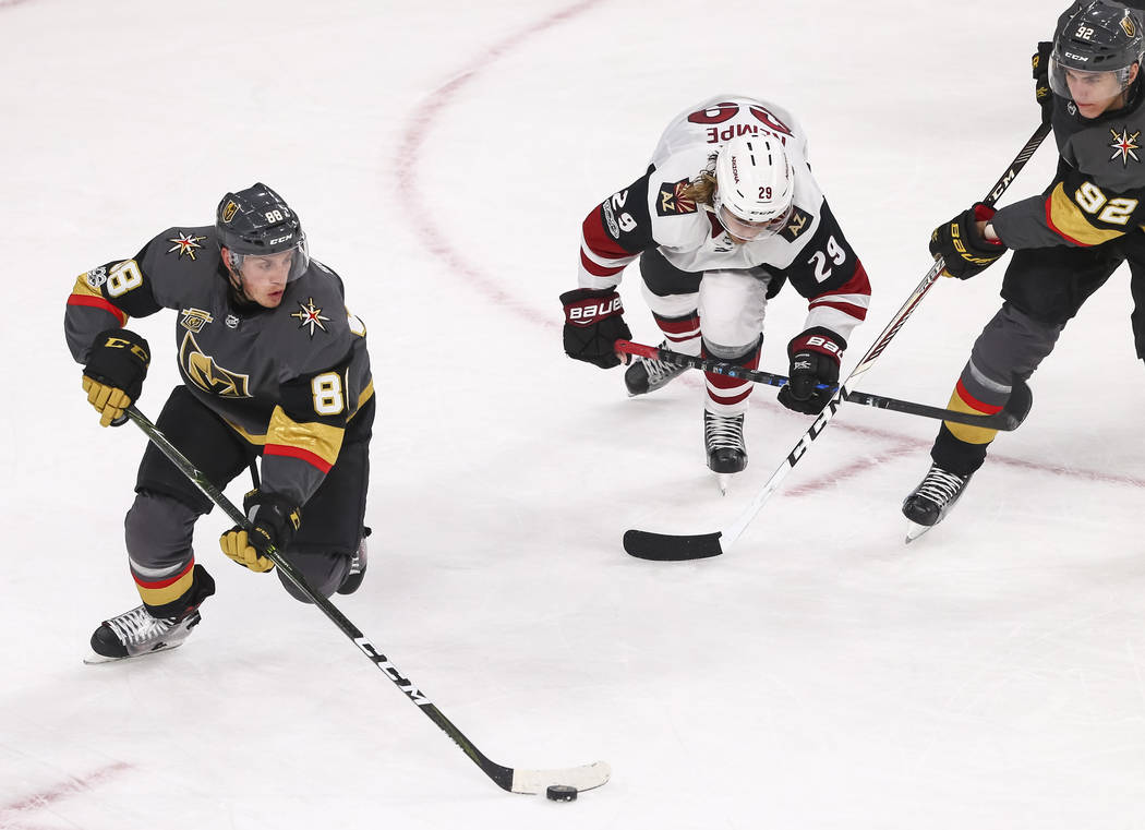 Vegas Golden Knights defenseman Nate Schmidt (88) controls the puck during the third period of an NHL hockey game between the Vegas Golden Knights and the Arizona Coyotes, Tuesday, Oct. 10, 2017, ...