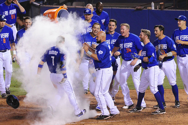 Las Vegas 51s players celebrate Brandon Nimmo's two-run walk off home run in the twelfth inning of their Triple-A minor league baseball game against the Round Rock Express at Cashman Field in Las ...