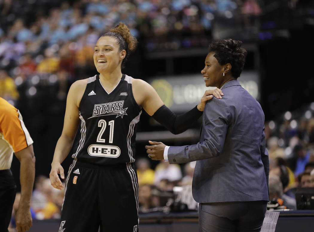 FILE - In this July 12, 2017, file photo, San Antonio Stars' Kayla McBride laughs with head coach Vickie Johnson during the second half of a WNBA basketball game against the Indiana Fever, in Indi ...