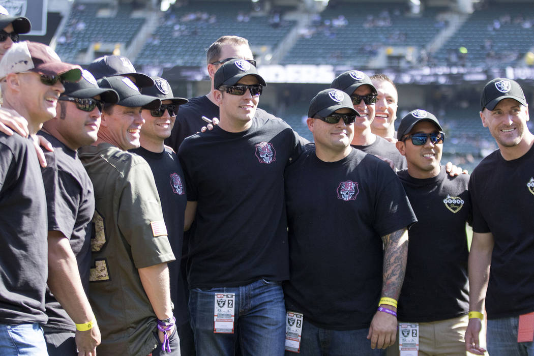 First responders from the Las Vegas shooting have VIP access to the field before the Oakland Raiders game against the Los Angeles Chargers in Oakland, Calif., Sunday, Oct. 15, 2017. Heidi Fang Las ...