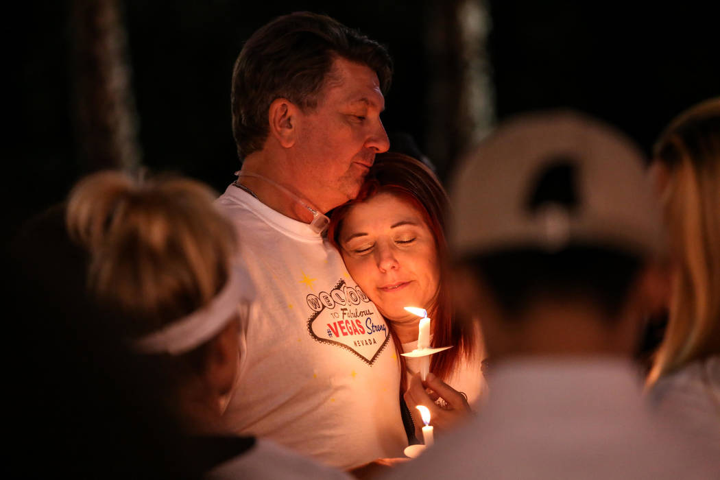 Michael Almeido, 54, and his sister Jennifer Almeido, 46, both of Las Vegas, gather across Mandalay Bay during the Vegas Strong Las Vegas Strip Walk honoring the victims of the Route 91 Harvest Fe ...