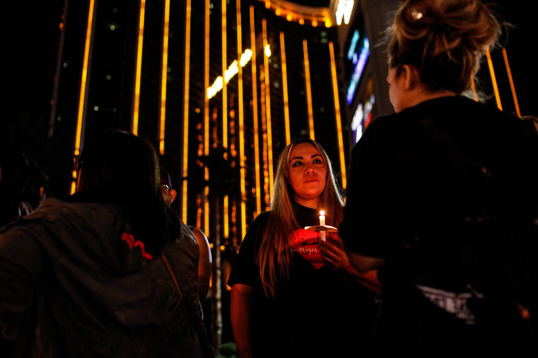 Alma Martinez of Las Vegas, 34, gathers across Mandalay Bay during the Vegas Strong Las Vegas Strip Walk honoring the victims of the Route 91 Harvest Festival shooting in Las Vegas, Sunday, Oct. 1 ...
