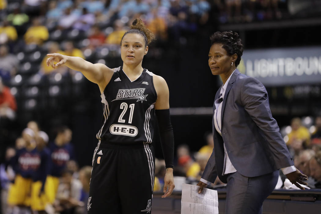 San Antonio Stars' Kayla McBride talks with head coach Vickie Johnson during the second half of a WNBA basketball game against the Indiana Fever, Wednesday, July 12, 2017, in Indianapolis. San Ant ...