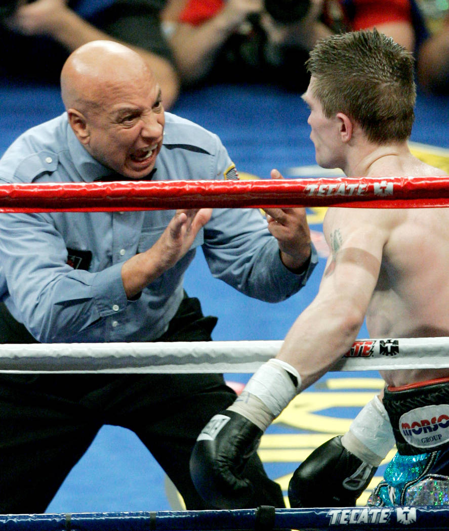 Referee Joe Cortez gives a count to Ricky Hatton of Great Britain after he was knocked down in the 10th round by Floyd Mayweather Jr., not shown,  in their super middleweight boxing match at the M ...