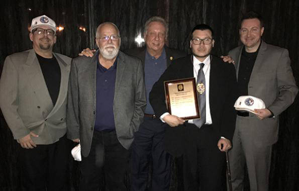 Jesus Campos, the Mandalay Bay security guard who first encountered mass shooter Stephen Paddock, second from right, is shown in an image provided by the International Union, Security, Police and  ...