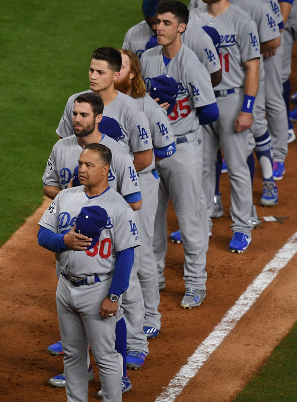 Oct 27, 2017; Houston, TX, USA; Los Angeles Dodgers manager Dave Roberts (30) lines up with his team before game three of the 2017 World Series against the Houston Astros at Minute Maid Park. Mand ...