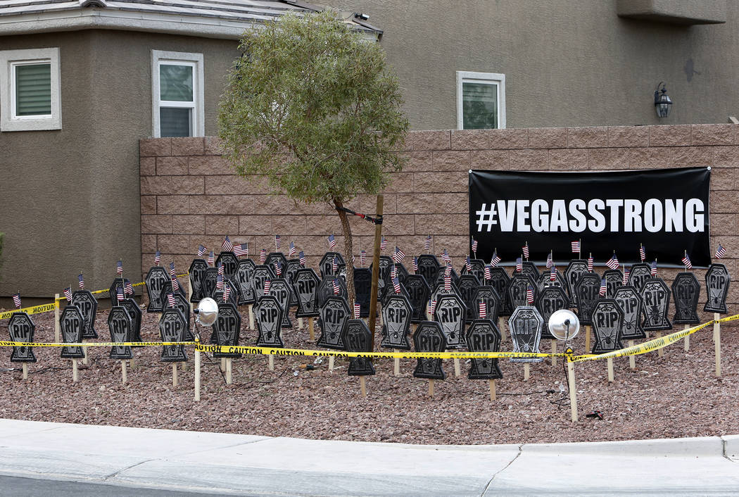 A Halloween display on Wednesday, Oct. 18, 2017 in a Las Vegas Valley neighborhood with 58 headstones, one for each of the victims of the Route 91 Harvest Festival shooting. Bizuayehu Tesfaye Las  ...