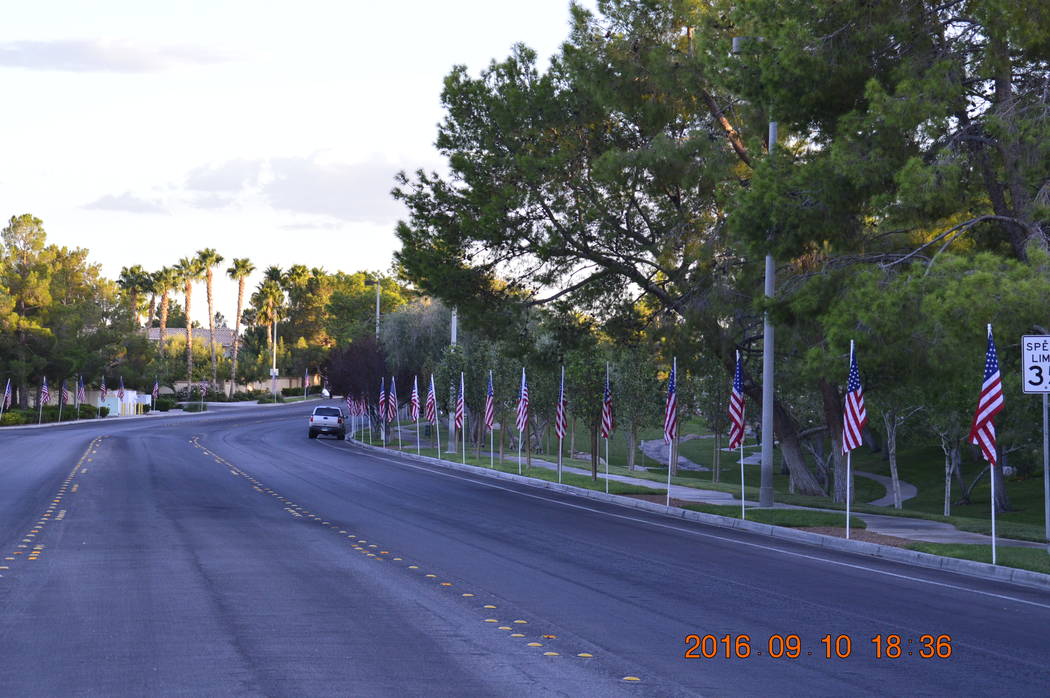 Flags line Apple Way in this photo taken soon after 9-11. Boys Scouts Troop 425 will do a similar project to coincide with the six trees being dedicated Nov. 4, 2017. (Peccole Ranch/Special)