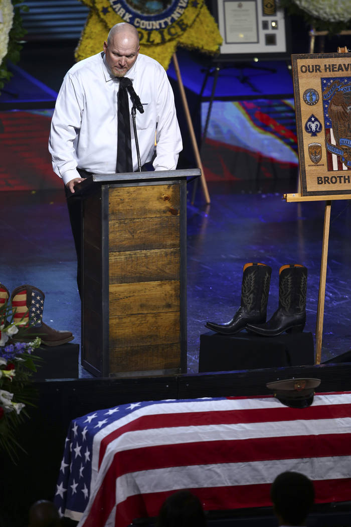 Chris Stockton speaks during a funeral for Las Vegas police officer Charleston Hartfield, Friday, Oct. 20, 2017, in Henderson, Nev. Hartfield was killed by a gunman shooting from a hotel into a cr ...