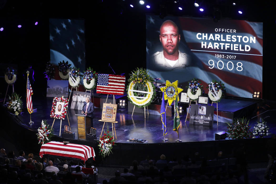 Pastor Mike Ellingsen speaks during a funeral for Las Vegas police officer Charleston Hartfield, Friday, Oct. 20, 2017, in Henderson, Nev. Hartfield was killed by a gunman shooting from a hotel in ...