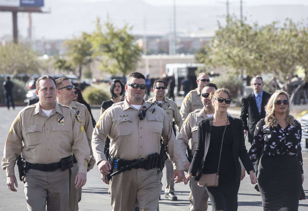 Metro officers walk towards Central Church for the service for Charleston Hartfield, the off-duty officer killed during the Route 91 shooting on Friday, October, 20, 2017, in Henderson. Benjamin H ...