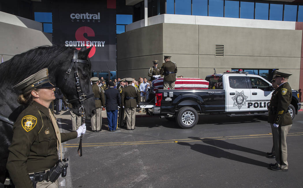 The body of Metro officer Charleston Hartfield is carried into Central Church during a service for the off-duty officer killed during the Route 91 shooting on Friday, October, 20, 2017, in Henders ...