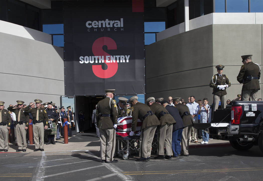 The body of Metro officer Charleston Hartfield is carried into Central Church during a service for the off-duty officer killed during the Route 91 shooting on Friday, October, 20, 2017, in Henders ...