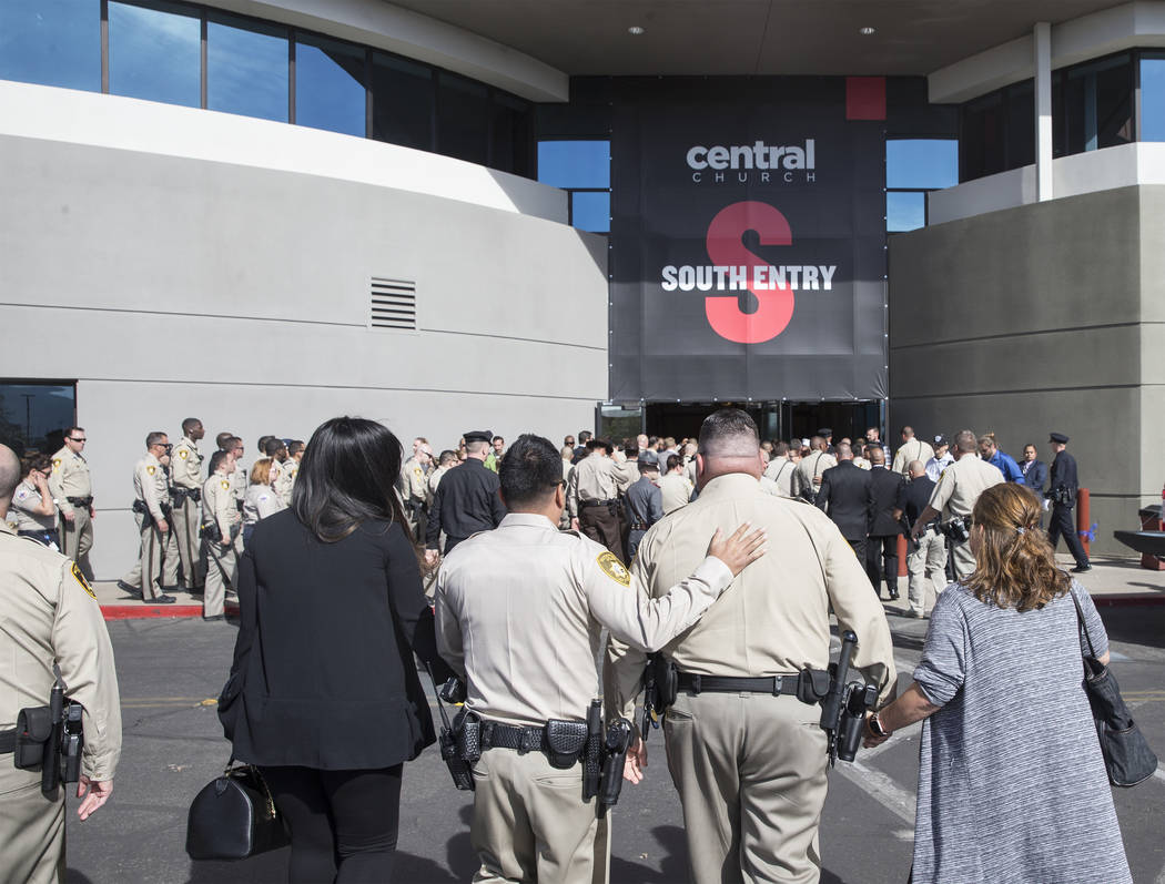 Metro officers walk into Central Church for the service for Charleston Hartfield, the off-duty officer killed during the Route 91 shooting on Friday, October, 20, 2017, in Henderson. Benjamin Hage ...