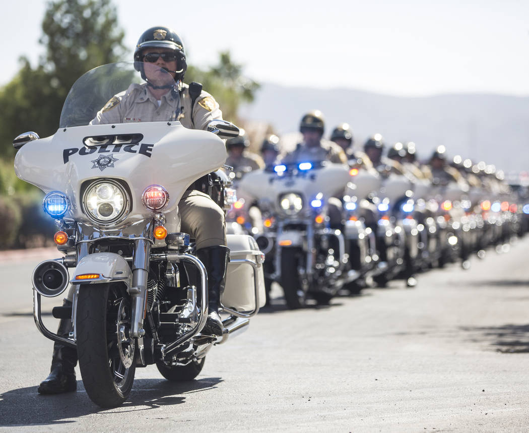 A motorcade of Metro officers prepare to transport the body of Charleston Hartfield at the conclusion of the service for the off-duty officer killed during the Route 91 shooting on Friday, October ...