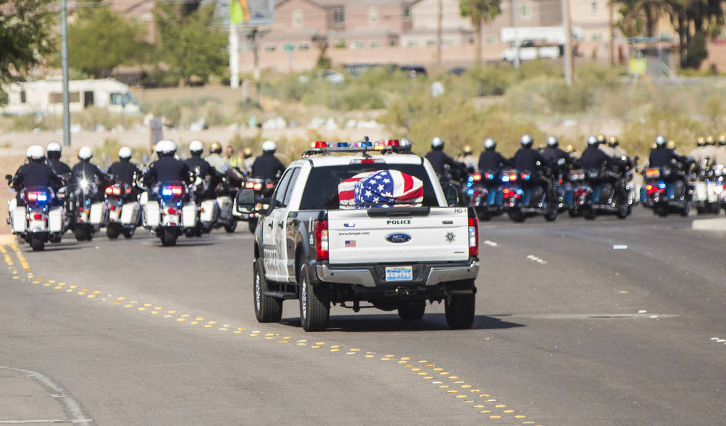 A motorcade of Metro officers transport the body of Charleston Hartfield at the conclusion of the service for the off-duty officer killed during the Route 91 shooting on Friday, October, 20, 2017, ...