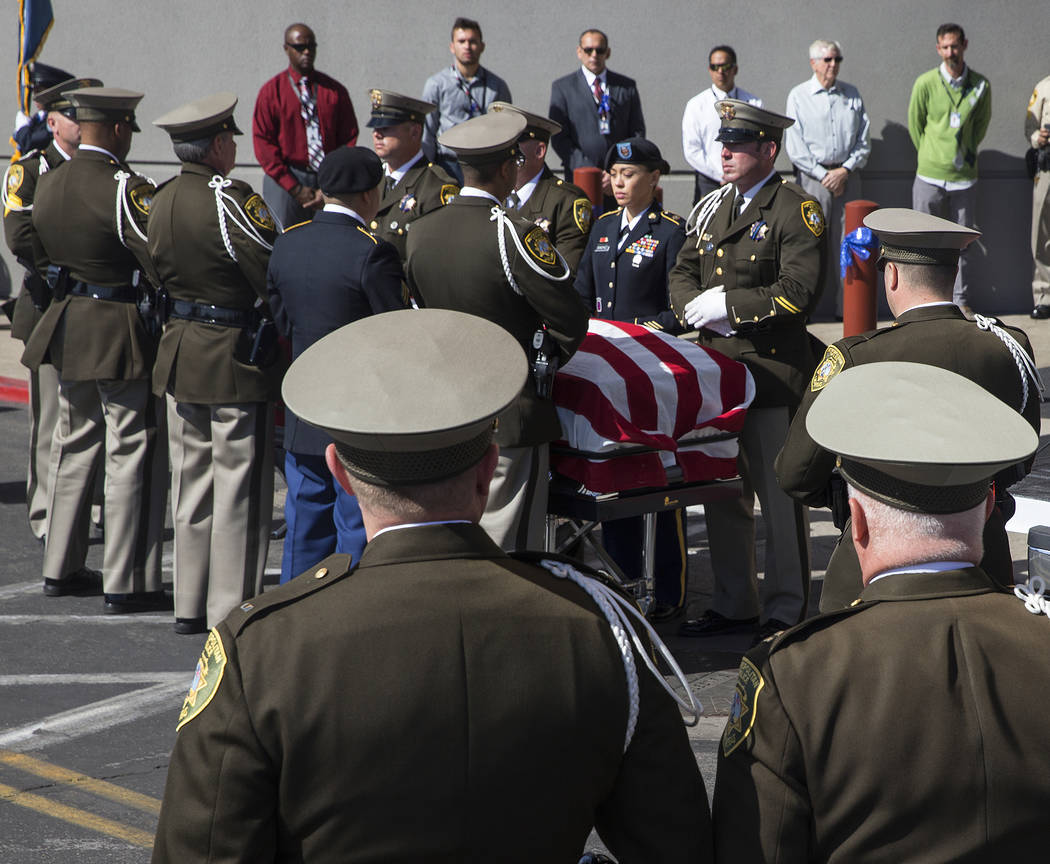 Metro officers prepare to transport the body of Charleston Hartfield at the conclusion of the service for the off-duty officer killed during the Route 91 shooting on Friday, October, 20, 2017, at ...