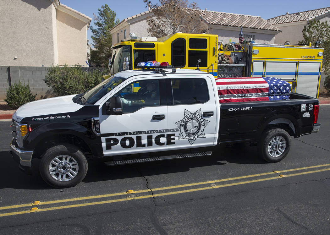 A motorcade of Metro officers transport the body of Charleston Hartfield at the conclusion of the service for the off-duty officer killed during the Route 91 shooting on Friday, October, 20, 2017, ...