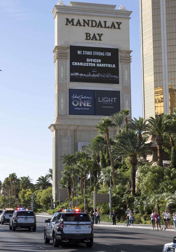 The procession for Metro officer Charleston Hartfield passes by Mandalay Bay en route to a memorial service on Friday, Oct. 20, 2017. Richard Brian Las Vegas Review-Journal @vegasphotograph